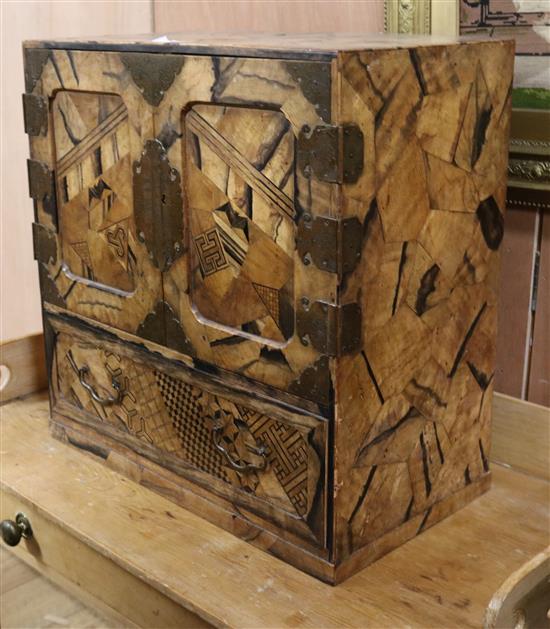 A Japanese parquetry chest/cabinet W.54cm